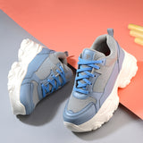 Women Casual Lace Up Sneaker with a gray mesh upper, blue leather panels, blue laces, and a thick white sole.