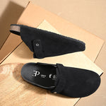 Black suede slip-on clog with a black rubber sole, adjustable strap, and Boston Soft Footbed for enhanced comfort and support.