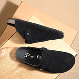 Black suede slip-on clog with a black rubber sole, adjustable strap, and Boston Soft Footbed for enhanced comfort and support.