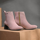 Light pink Suede ankle boots for women with a block heel and a sleek, minimalist design.
