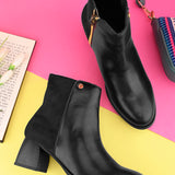 women black zip ankle length boots with a smooth leather front, suede back, block heel, pointed toe