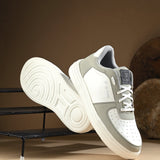 Men Solid Lace-Up Sneakers in white and grey with a sleek design and clean white sole, perfect for casual wear.