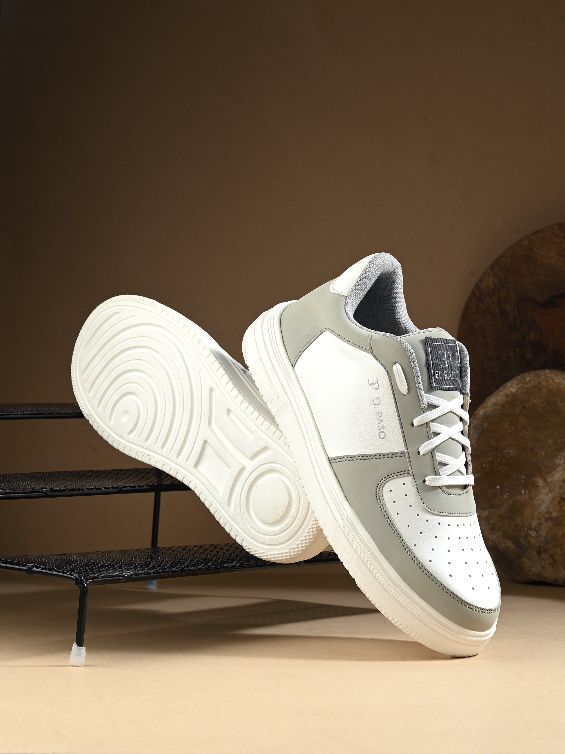 Men Solid Lace-Up Sneakers in white and grey with a sleek design and clean white sole, perfect for casual wear.