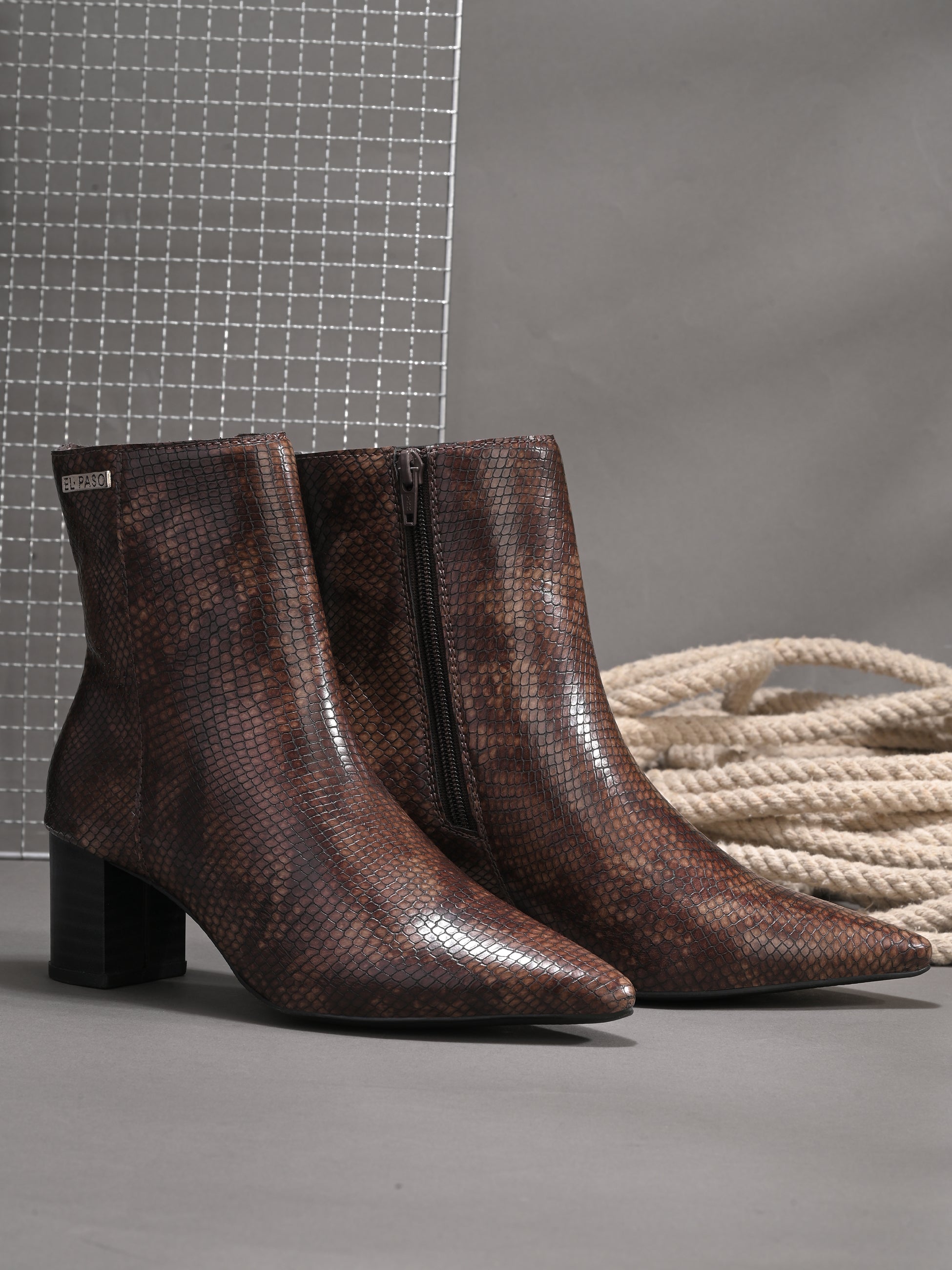 brown textured ankle boots with a sleek snakeskin pattern and a block heel design