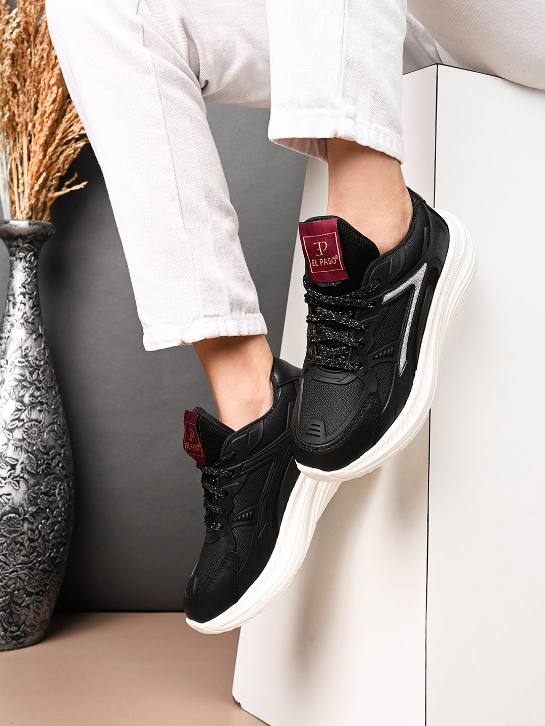 Solid Round Toe Sneakers for Women in black and white with a simple, sleek design for a versatile and stylish look.