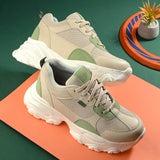 Beige and green chunky casual sneakers for women with a textured sole and modern design.