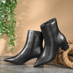 Black textured ankle boots with a sleek snakeskin pattern and a block heel design