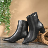 Black textured ankle boots with a sleek snakeskin pattern and a block heel design