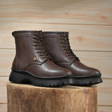 A Men's Ankle Length Block Heel boots with a side zipper, pull-tab at the back, and a low block heel.