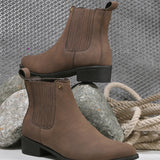 Brown suede Chelsea boots with ribbed elastic side panels, a pull-tab, and a low block heel for a stylish and comfortable fit