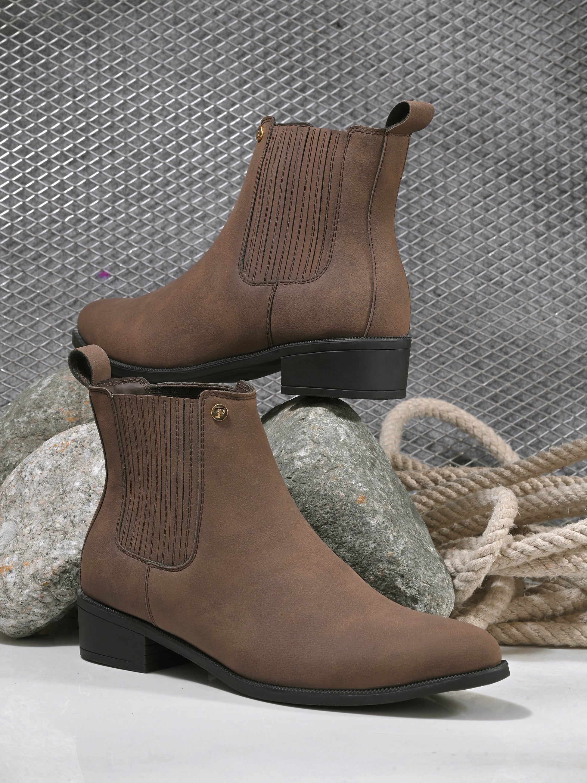 Brown suede Chelsea boots with ribbed elastic side panels, a pull-tab, and a low block heel for a stylish and comfortable fit