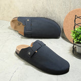 Blue suede slip-on clog with a black rubber sole, adjustable strap, and Boston Soft Footbed for enhanced comfort and support.