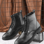 A Men's Ankle Length Block Heel boots with a side zipper, pull-tab at the back, and a low block heel.