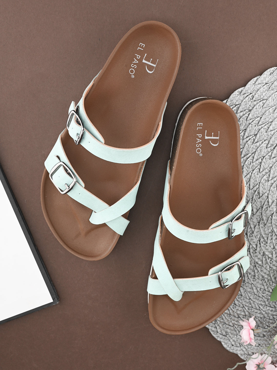 Women’s one-toe flats with a cork sole, silver buckles, and a casual slip-on design.