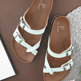 Women’s one-toe flats with a cork sole, silver buckles, and a casual slip-on design.