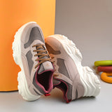 Women Casual Lace Up Sneaker with a brown mesh upper, pink leather panels, brown laces, and a thick white sole.