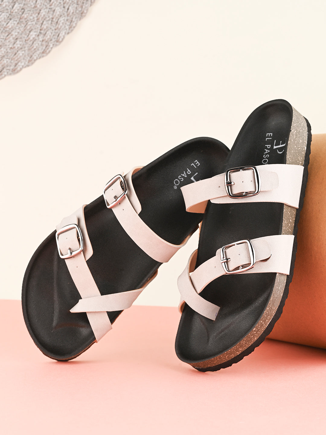 Women’s one-toe flats with a cork sole, silver buckles, and a casual slip-on design.