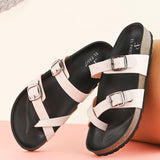 Women’s one-toe flats with a cork sole, silver buckles, and a casual slip-on design.