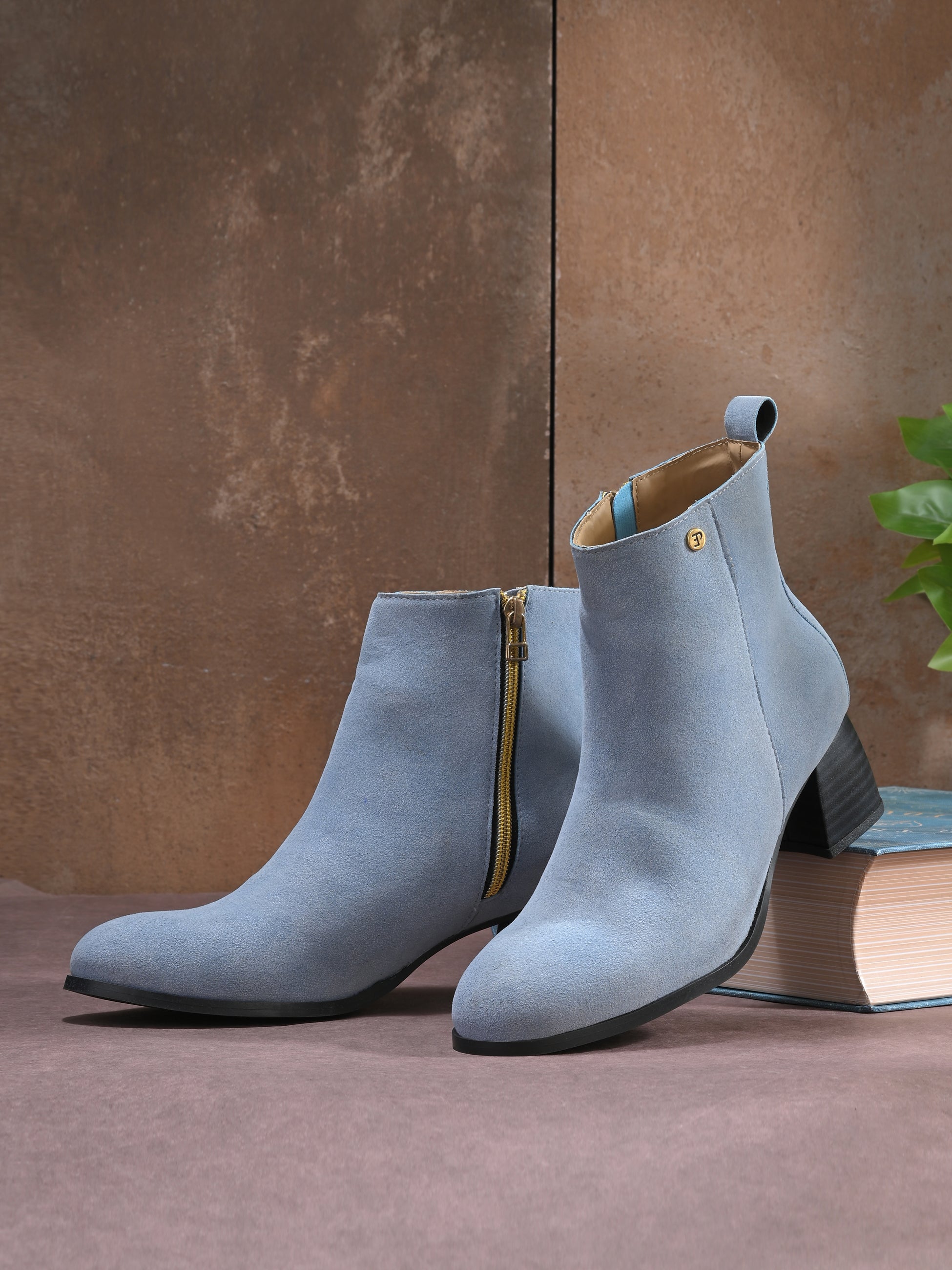 Light blue Suede ankle boots for women with a block heel and a sleek, minimalist design.