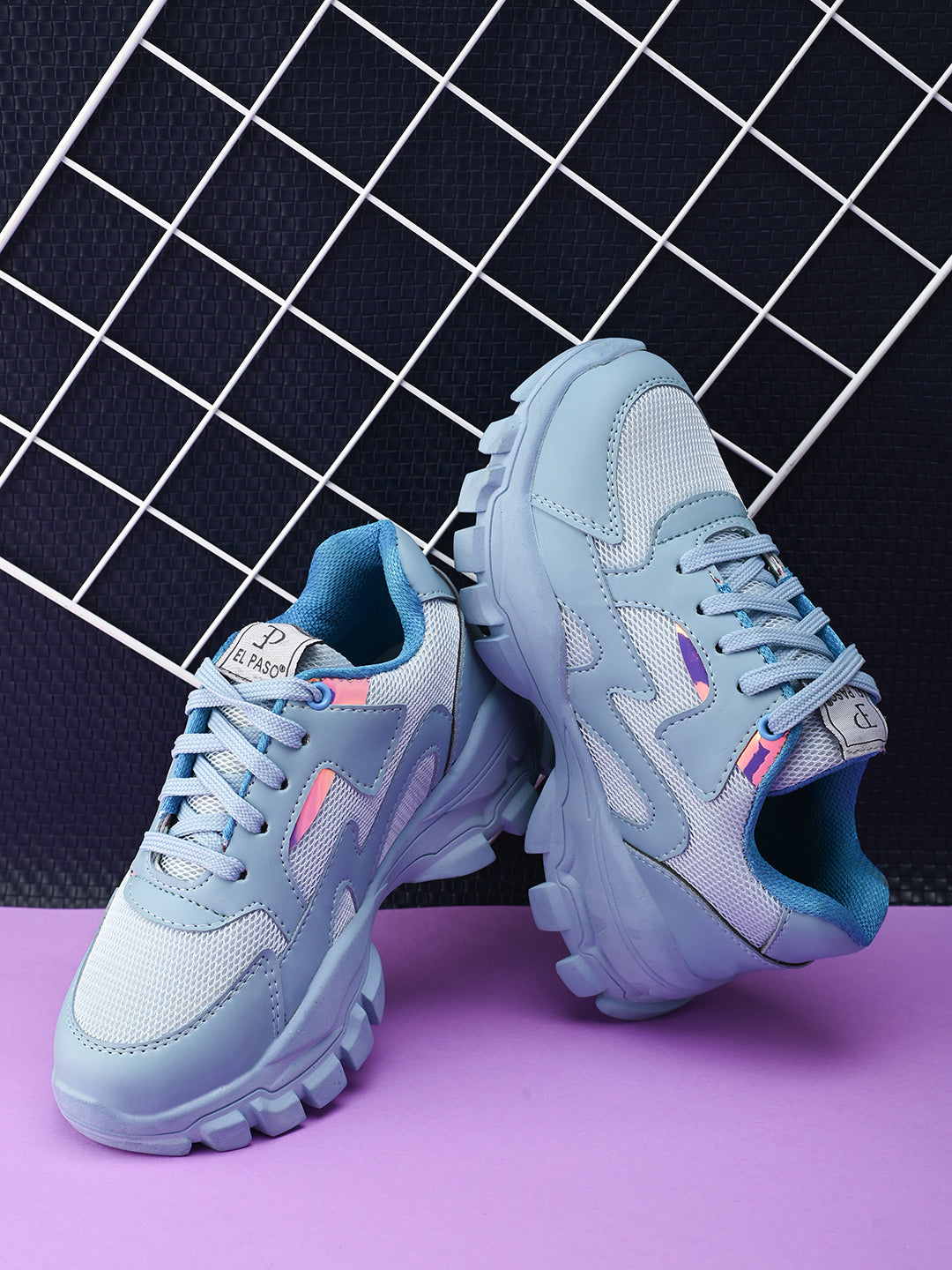 A pair of blue El Paso lace-up women's sneakers with chunky soles, mesh detailing, and subtle pink and white accents.
