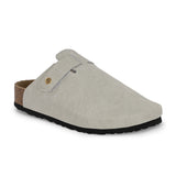 Nude suede slip-on clog with a black rubber sole and adjustable strap.