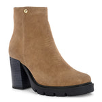 Glossy camel patent leather zip-closure ankle boot with a chunky block heel, lug sole, and a gold logo detail near the collar.