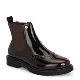 A glossy burgundy Chelsea boot with brogue detailing, elastic side panels, and a durable black sole, featuring a gold accent logo.