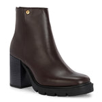 Glossy brown patent leather ankle boot with a chunky block heel, lug sole, and a gold logo detail near the collar.