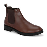 Brown Chelsea boots with elastic side panels, a pull-tab at the heel, rounded toe, and a small metallic brand logo near the ankle.