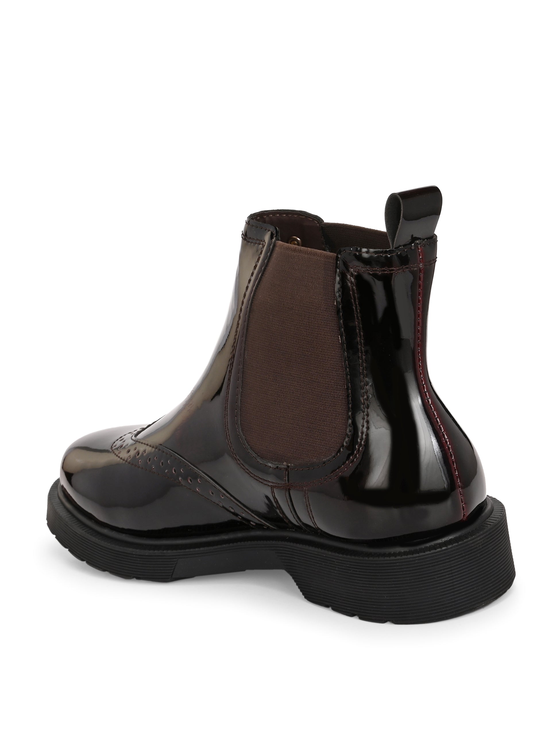 A glossy Wine Chelsea boot with brogue detailing, elastic side panels, and a durable black sole, featuring a gold accent logo.