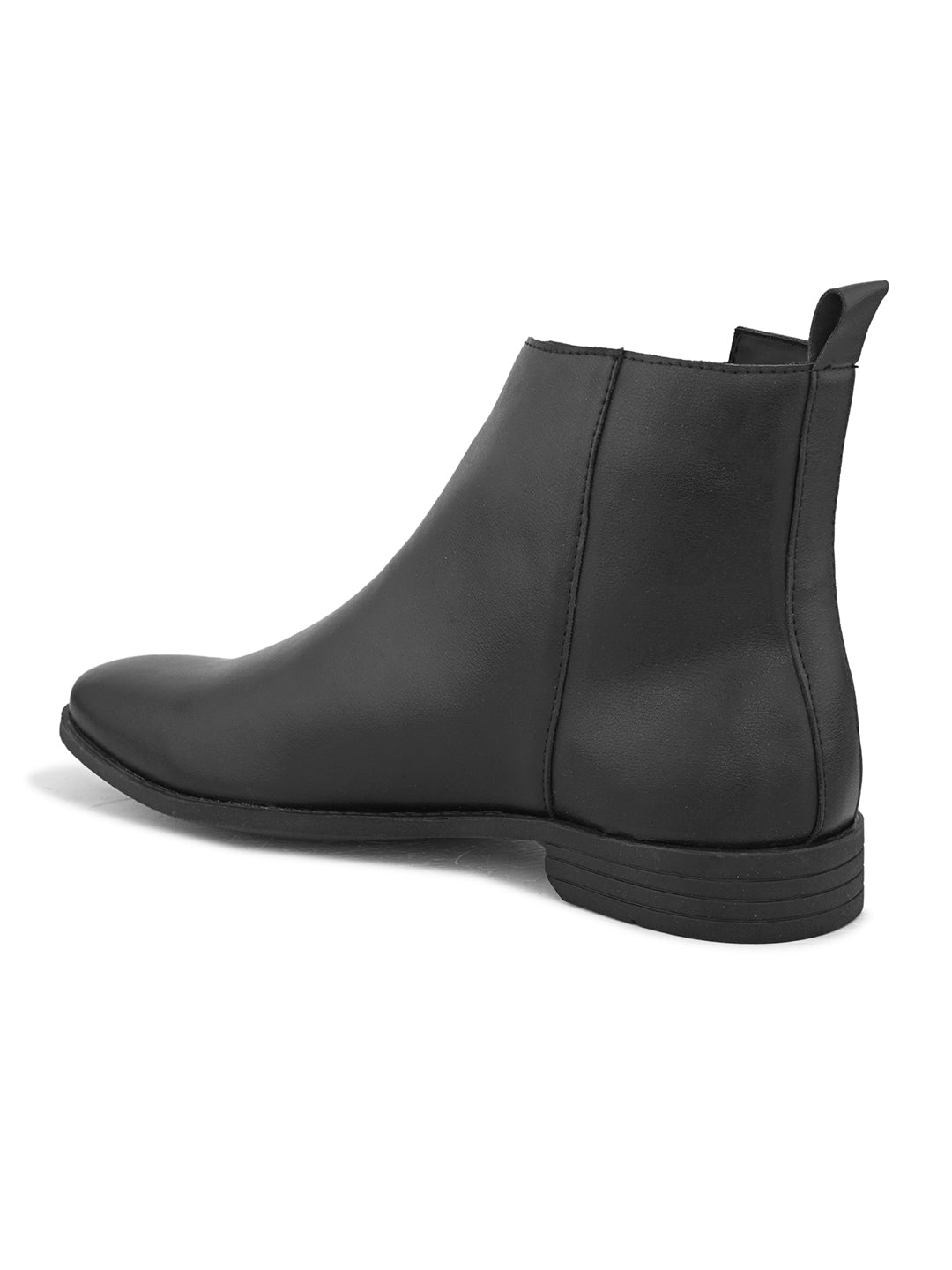 A sleek black leather Chelsea boot with a side zipper, pull-tab at the back, and a low block heel.