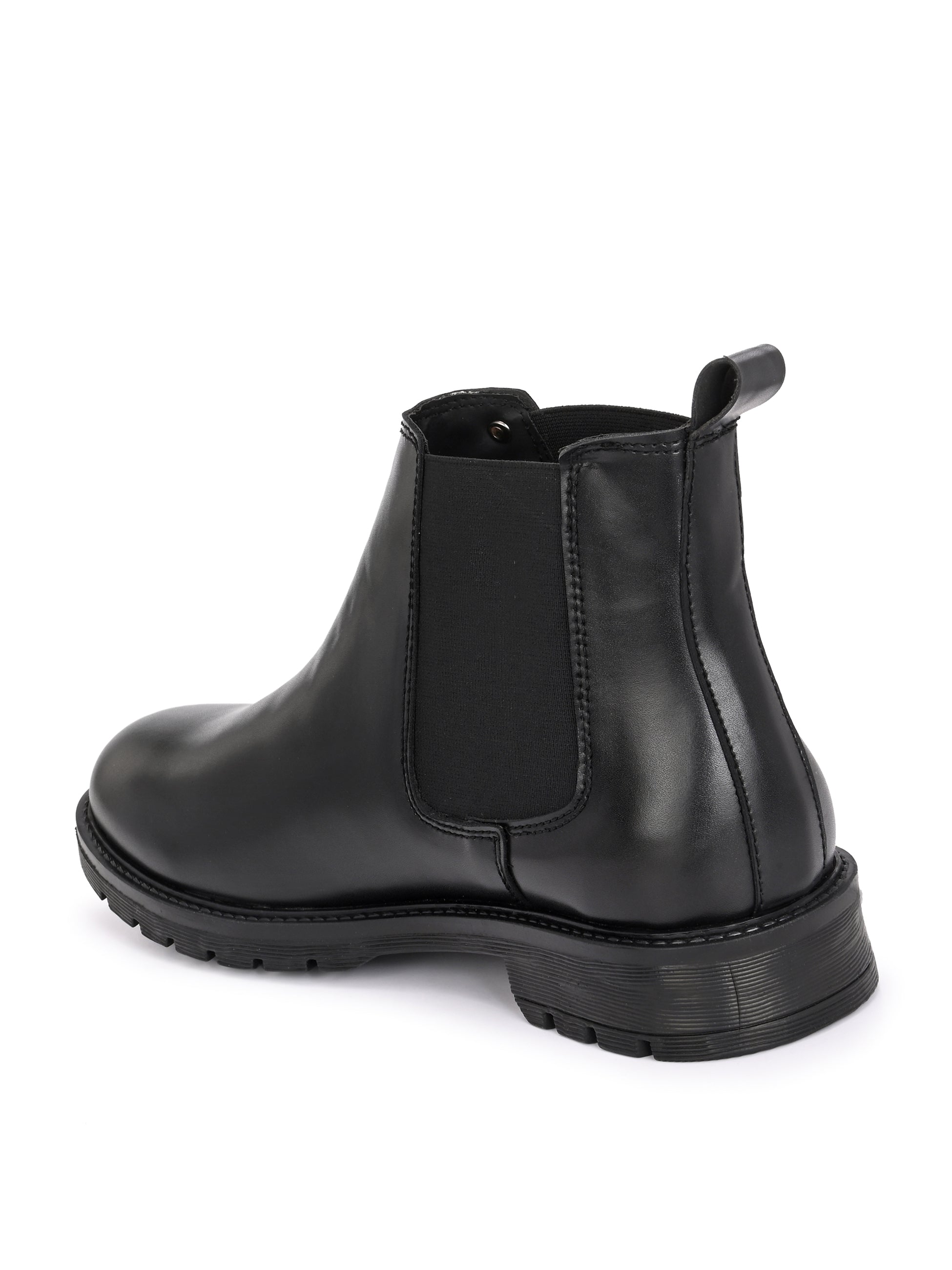 Classic Chelsea boots with elastic side panels, a pull-tab at the heel, rounded toe, and a small metallic brand logo near the ankle.