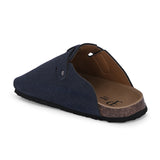 Blue suede slip-on clog with a black rubber sole and adjustable strap.