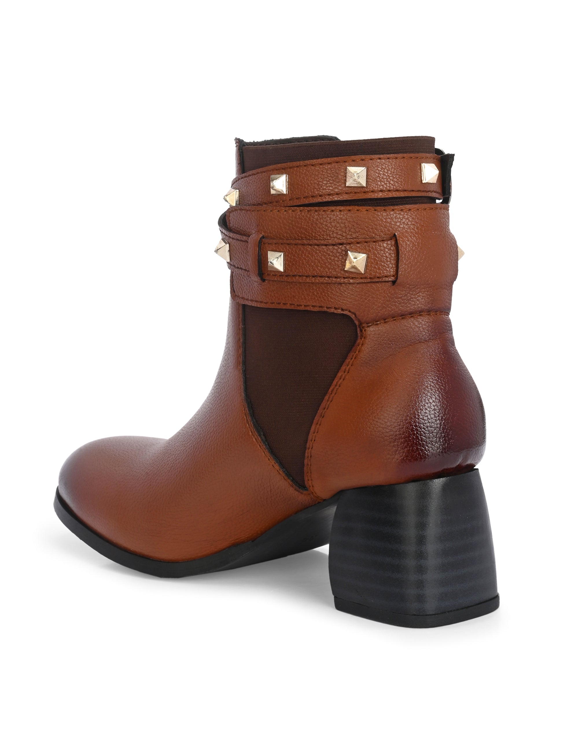 Brown leather ankle boots with studded straps and a buckle design.