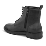 A sleek black patent leather Chelsea lace-up boot with a side zipper, pull-tab at the back, and a low block heel.