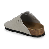 Nude suede slip-on clog with a black rubber sole and adjustable strap.