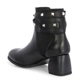 Black leather ankle boots with studded straps and a buckle design.