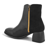 Black ankle boot with a smooth leather front, suede back, block heel, pointed toe with a zip