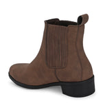 Brown suede slip-on boots with ribbed elastic panels, a pull-tab, and a low block heel for a stylish, comfortable fit.