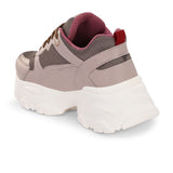 A chunky sneaker with a brown mesh upper, pink leather panels, brown laces, and a thick white sole.