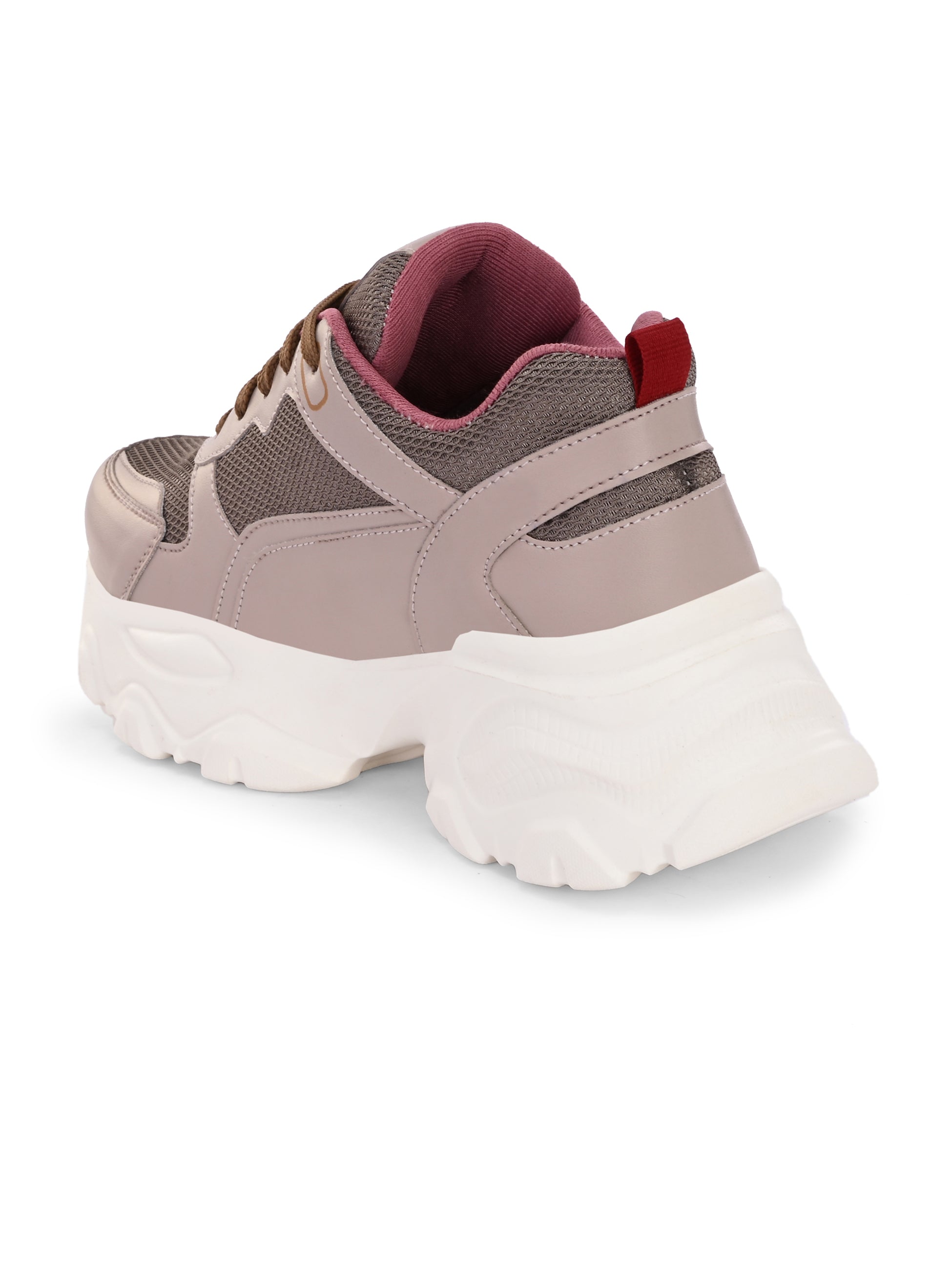 A chunky sneaker with a brown mesh upper, pink leather panels, brown laces, and a thick white sole.