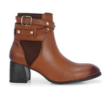 Brown leather ankle boots with studded straps and a buckle design.