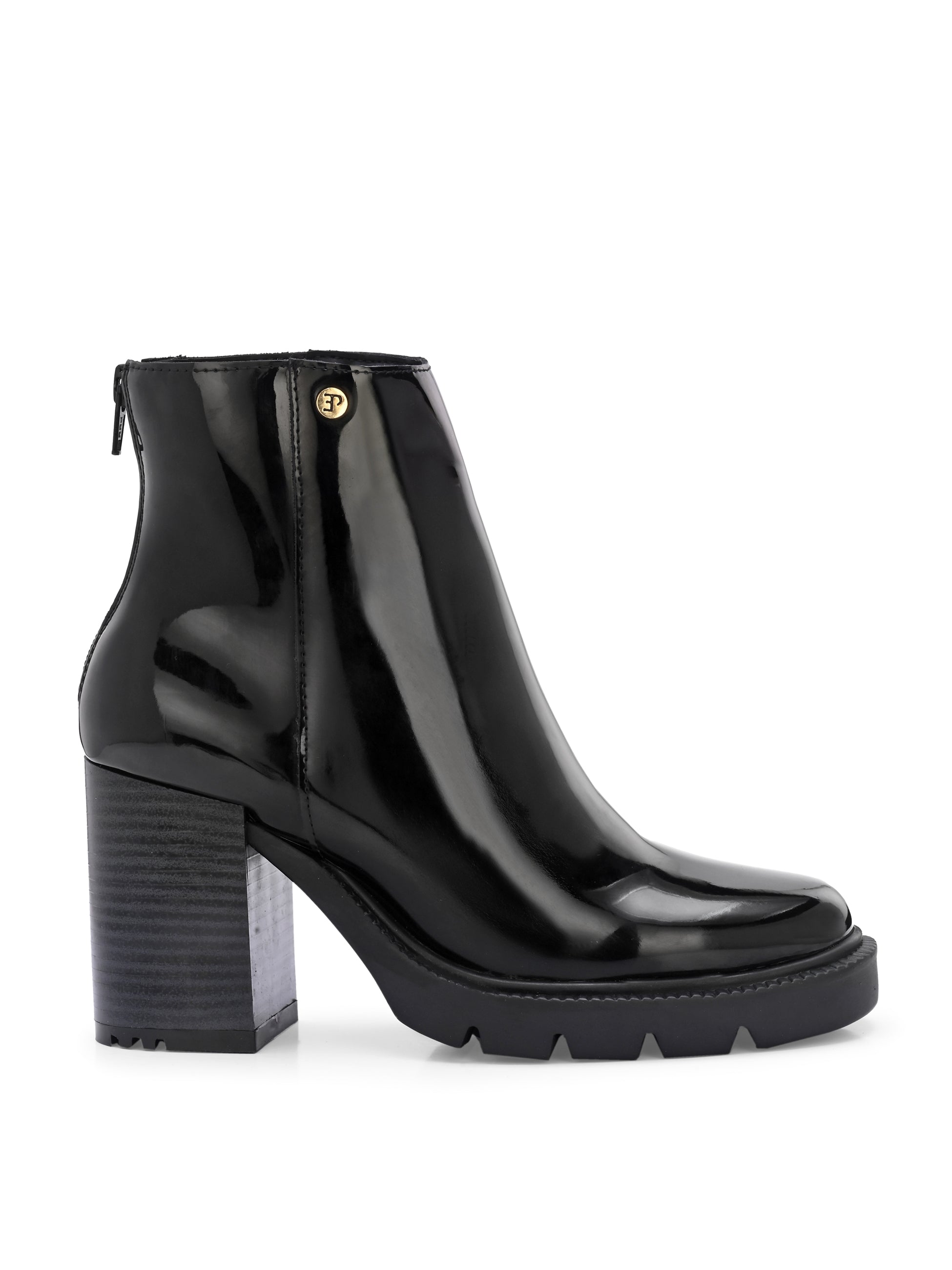 Glossy black patent leather ankle boot with a chunky block heel, lug sole, and a gold logo detail near the collar.