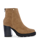 Glossy black patent leather ankle boot with a chunky block heel, lug sole, and a gold logo detail near the collar.