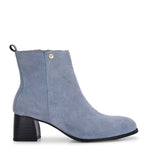 Light blue heigh top boot with a block heel and a sleek, minimalist design.