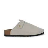 Nude suede slip-on clog with a black rubber sole and adjustable strap.