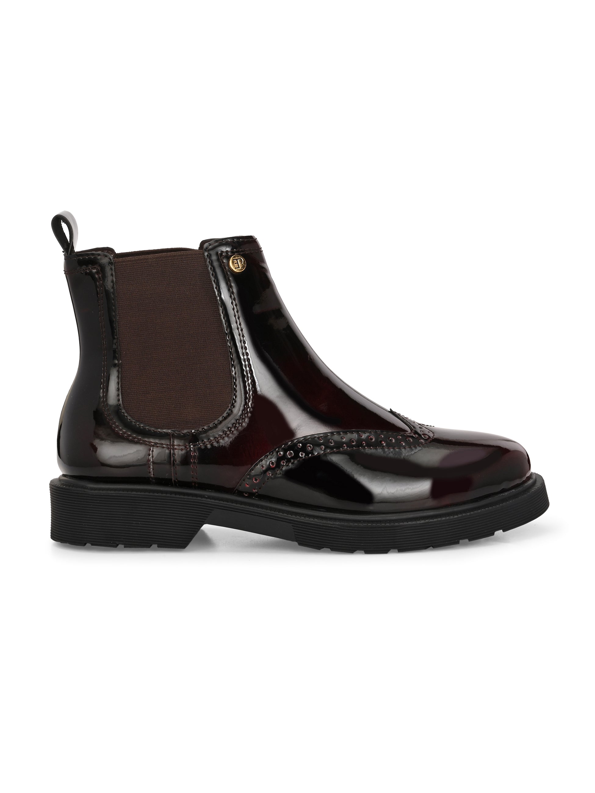 A glossy Wine Chelsea boot with brogue detailing, elastic side panels, and a durable black sole, featuring a gold accent logo.