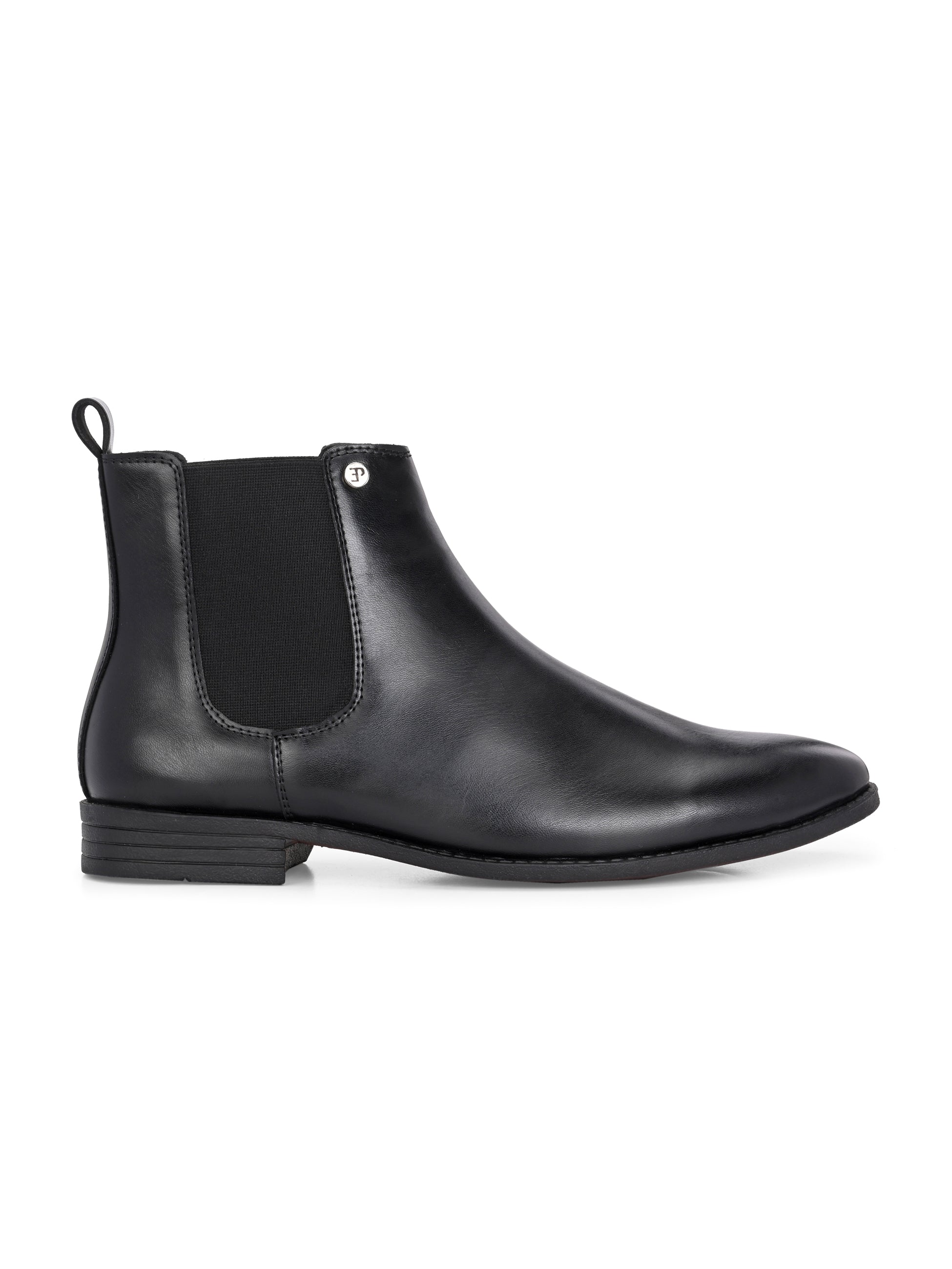 A sleek black leather Chelsea boot for women with elastic side panels, pull tab, low stacked heel, and a polished finish for a versatile look.