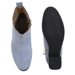 Light blue heigh top boot with a block heel and a sleek, minimalist design.