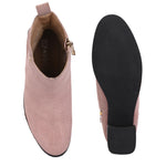 Light pink heigh top boot with a block heel and a sleek, minimalist design.